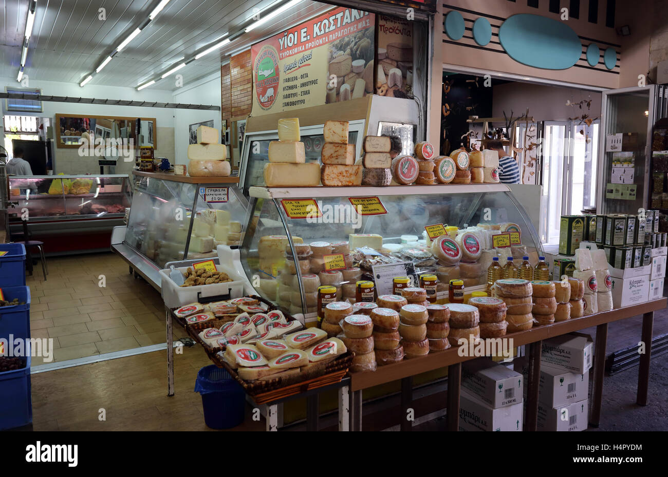 Cheese and meat shop - a traditional combination in Greece - in the covered market at the centre of Chania, Crete. Stock Photo
