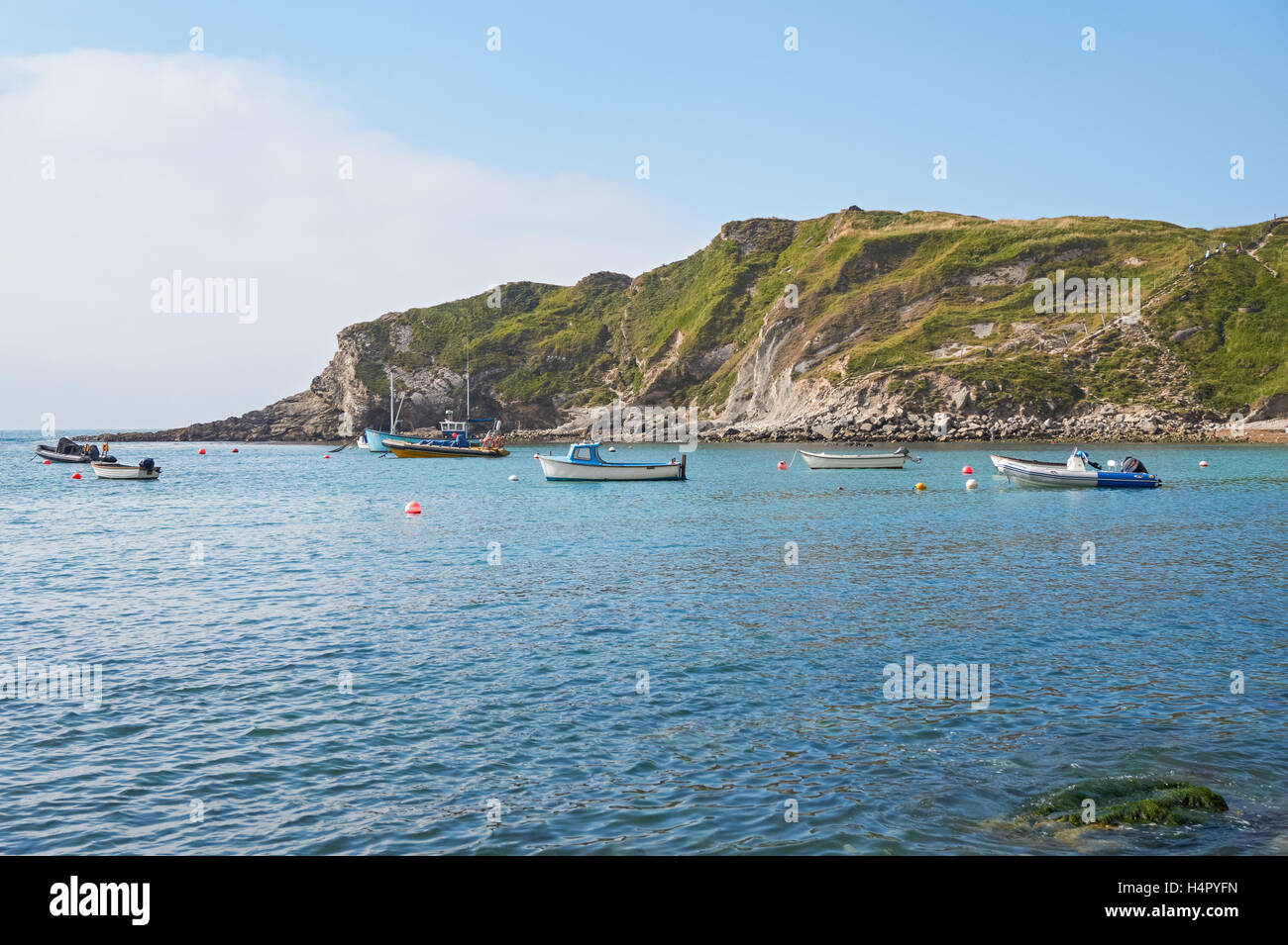 Boats in Lulworth Cove, Dorset England United Kingdom UK Stock Photo