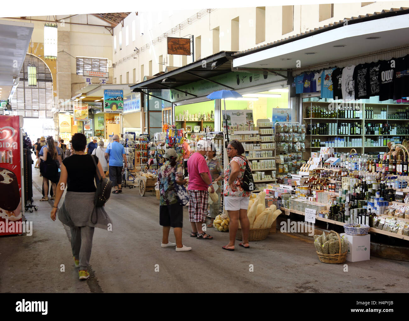 Shoppers in action in the covered market at the centre of the city of Chania, in Crete, Greece, with some motion blur Stock Photo