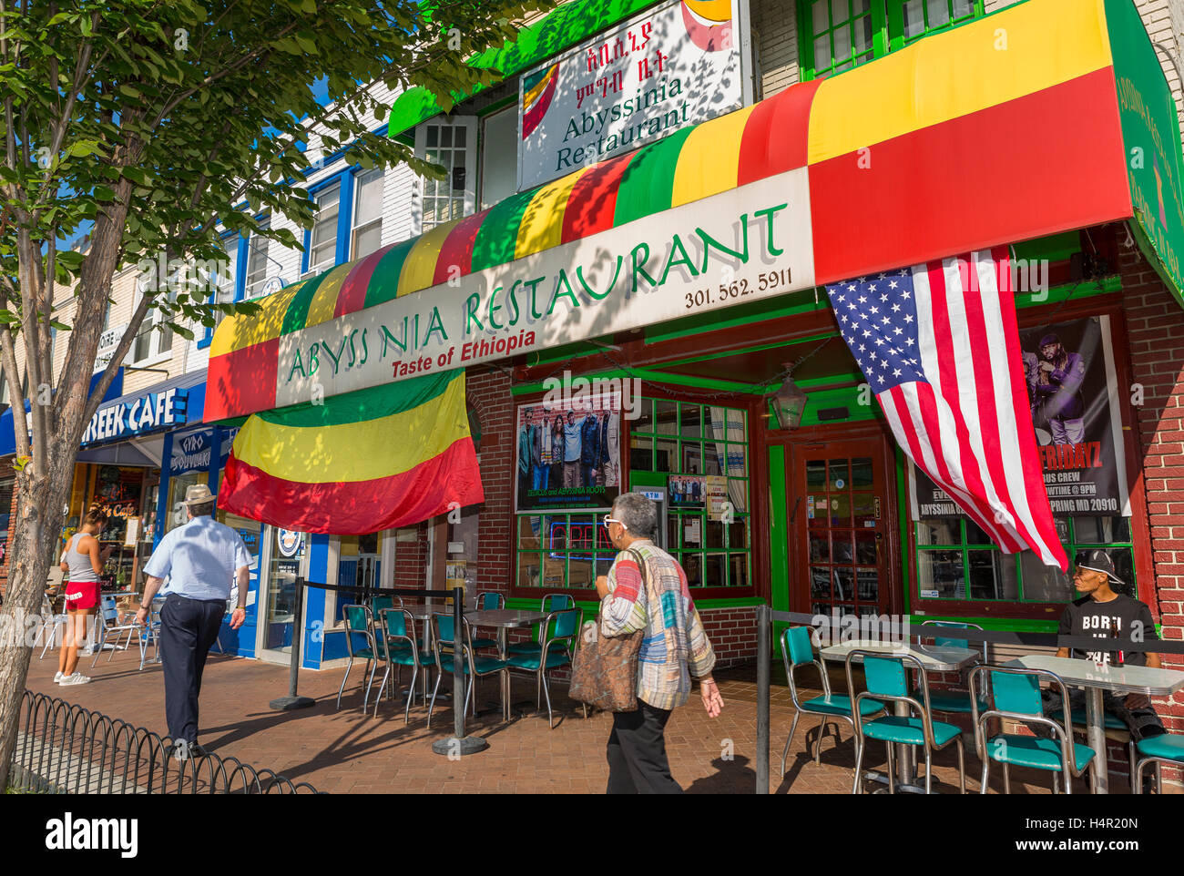 SILVER SPRING, MARYLAND, USA - People walk by Abyssinia Ethiopian Restaurant on Georgia Avenue. Stock Photo