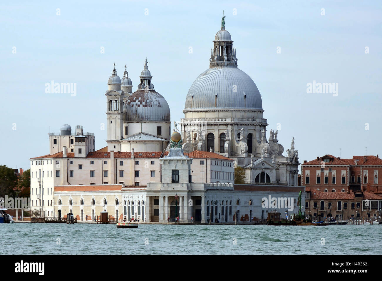 Basilica Santa Maria della Salute with the Punta della Dogana of Venice in Italy. Stock Photo
