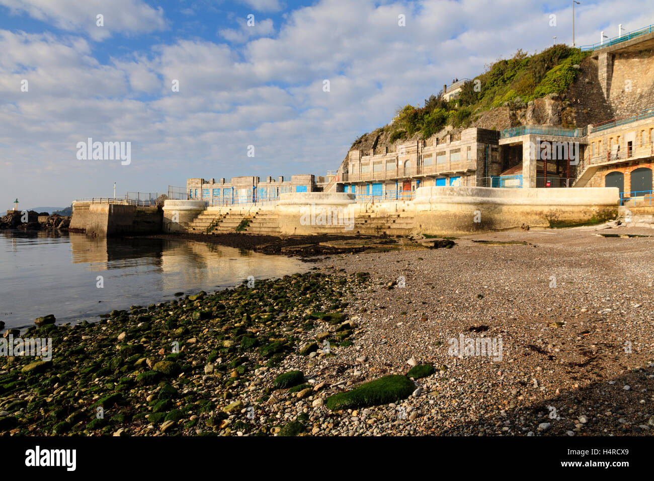 Beach, steps, sea defences and changing facilities on the East side of Tinside lido on Plymouth Hoe, Devon, UK Stock Photo