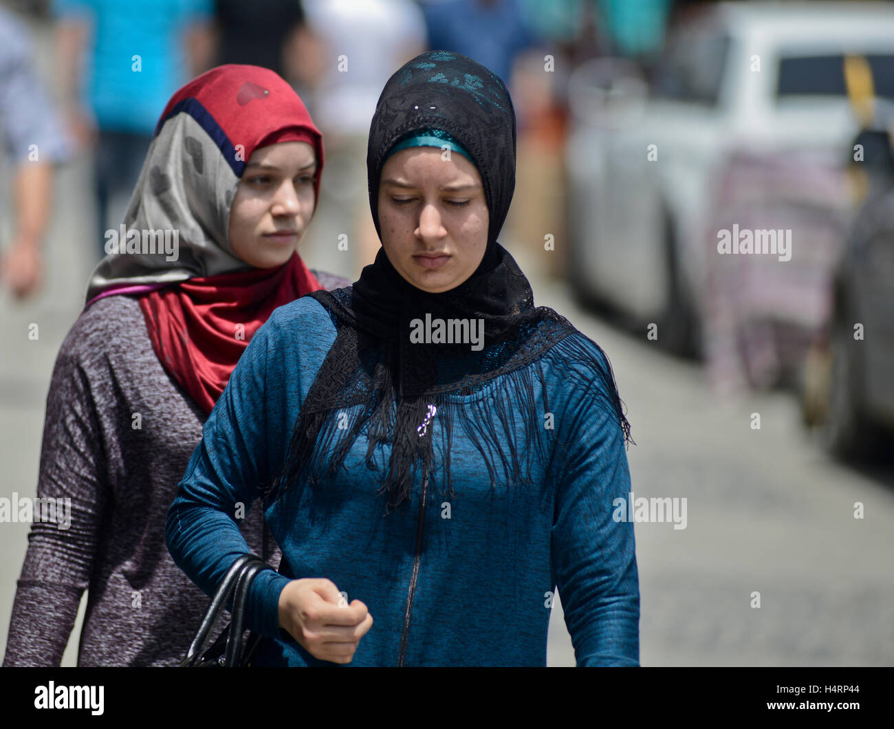 Muslim women walking  across the Old Bazaar. Skopje, Macedonia Stock Photo
