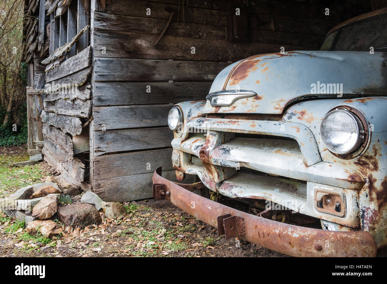 Weathered barn with a 1954 Chevy truck in Lawrenceville, Georgia. (USA) Stock Photo