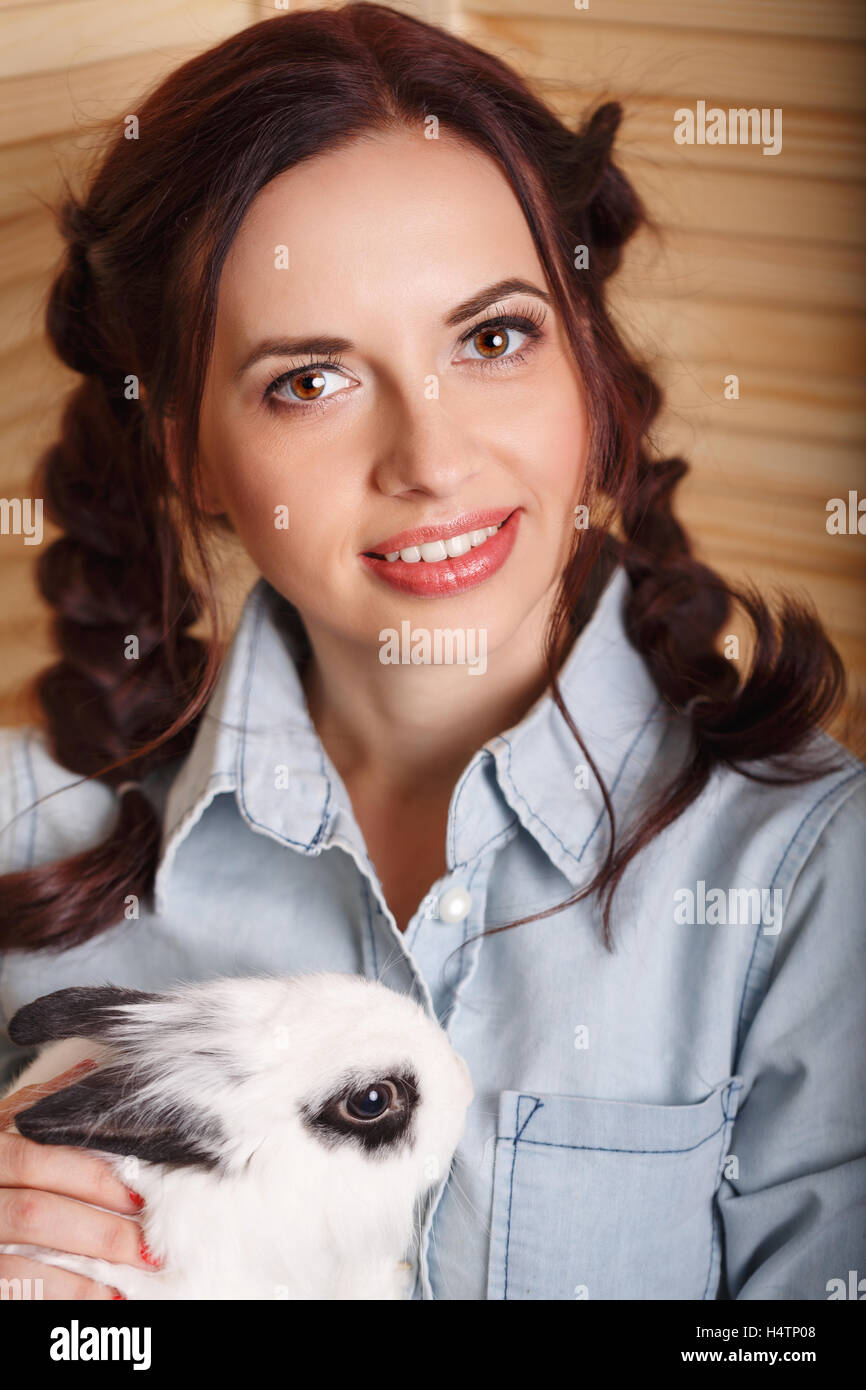 Lovely girl with a rabbit in his arms. Pets Stock Photo - Alamy