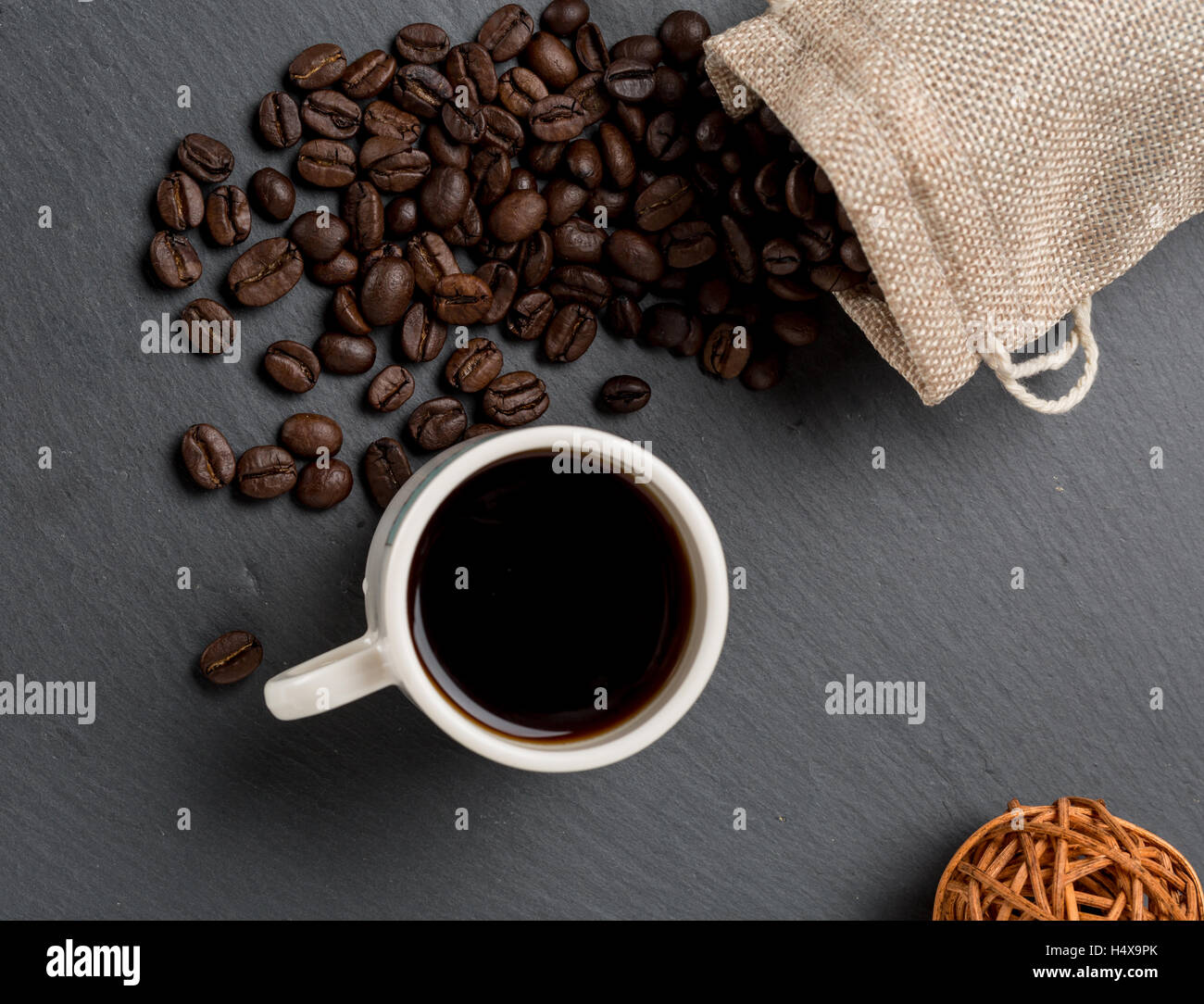 Heap coffe beans and cup of fresh coffee Stock Photo