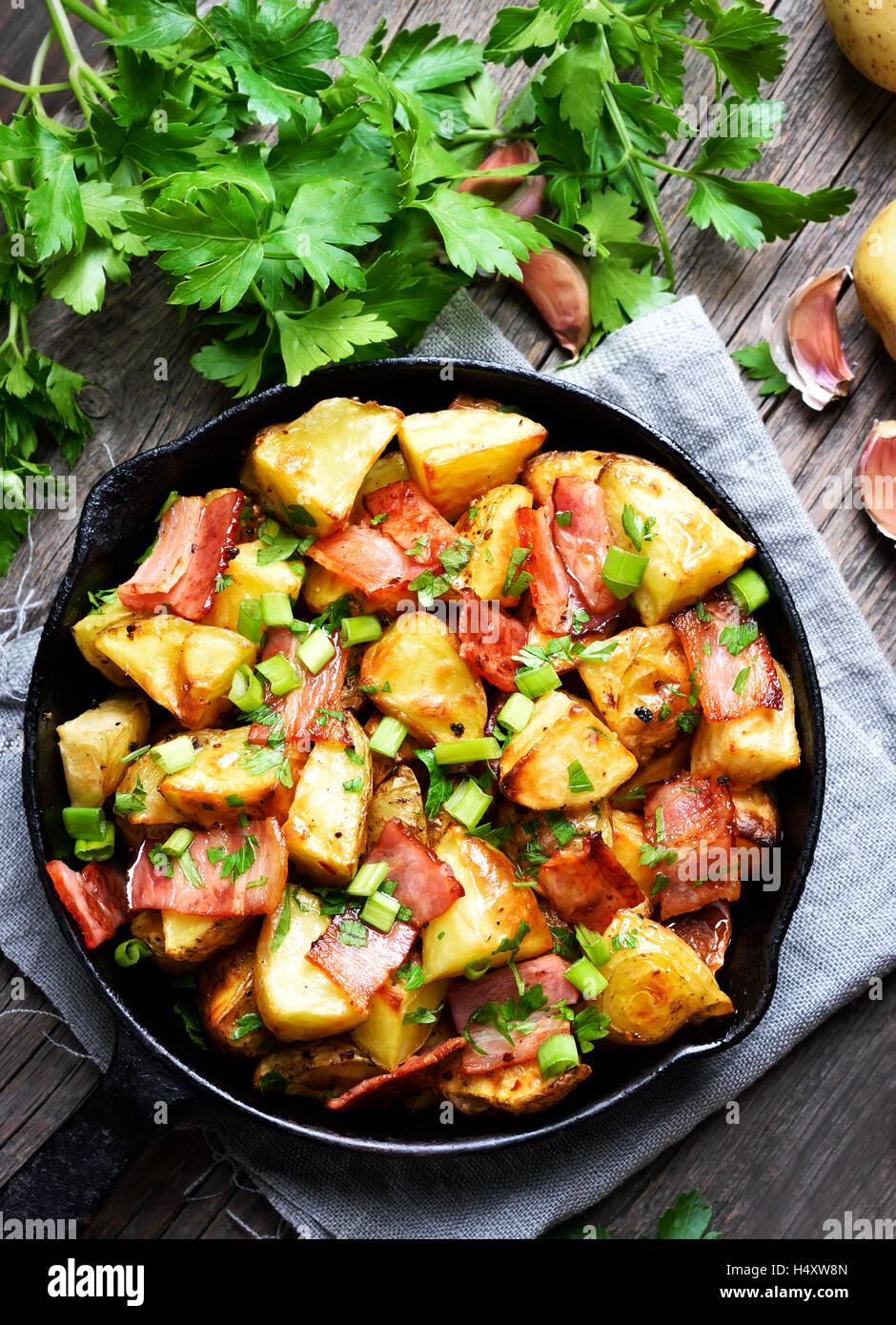 Potatoes baked with bacon and onion, top view Stock Photo Alamy