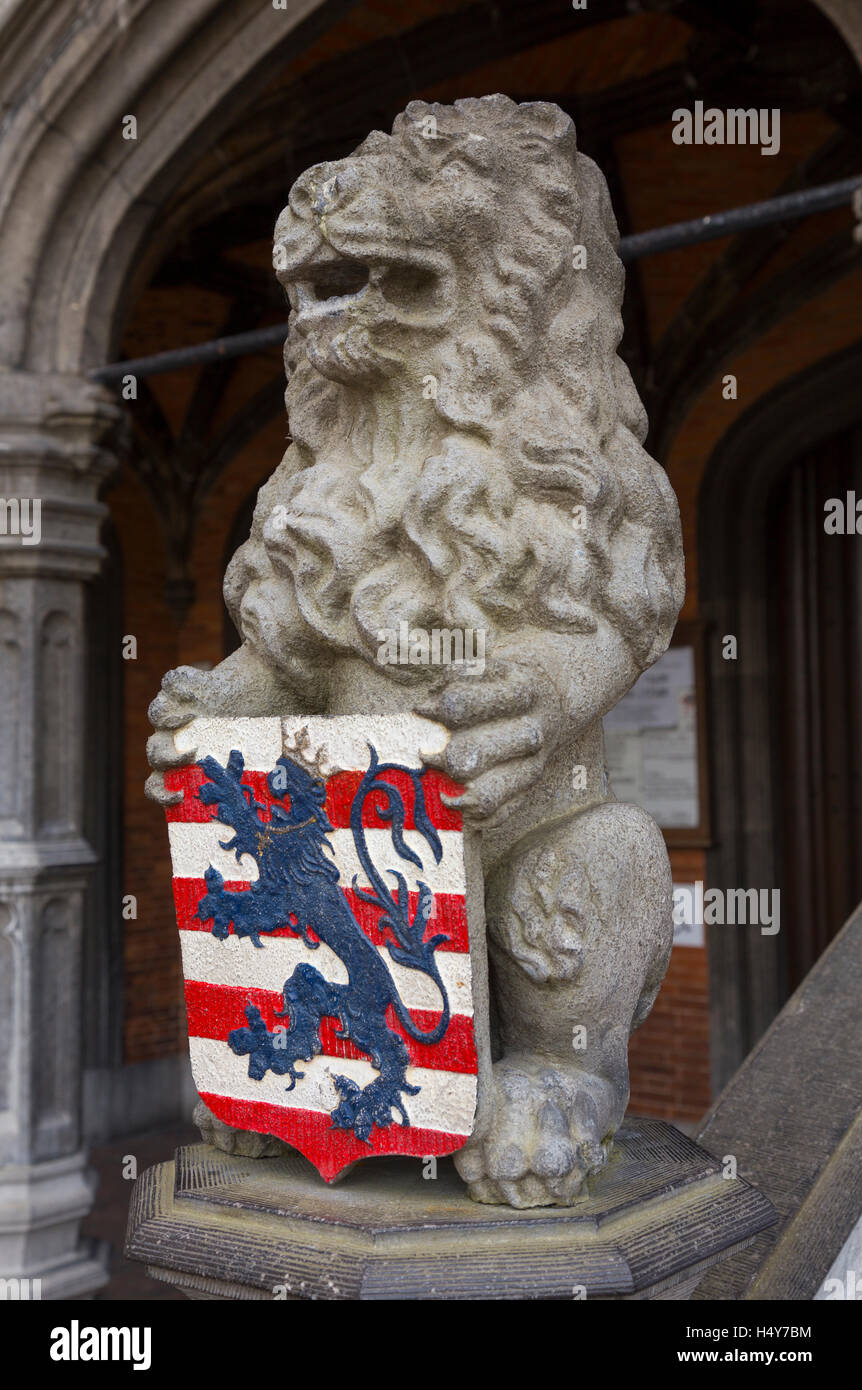 Lion statue with coat of arms at the Basilica of the Holy Blood, Burg, Bruges, Belgium Stock Photo