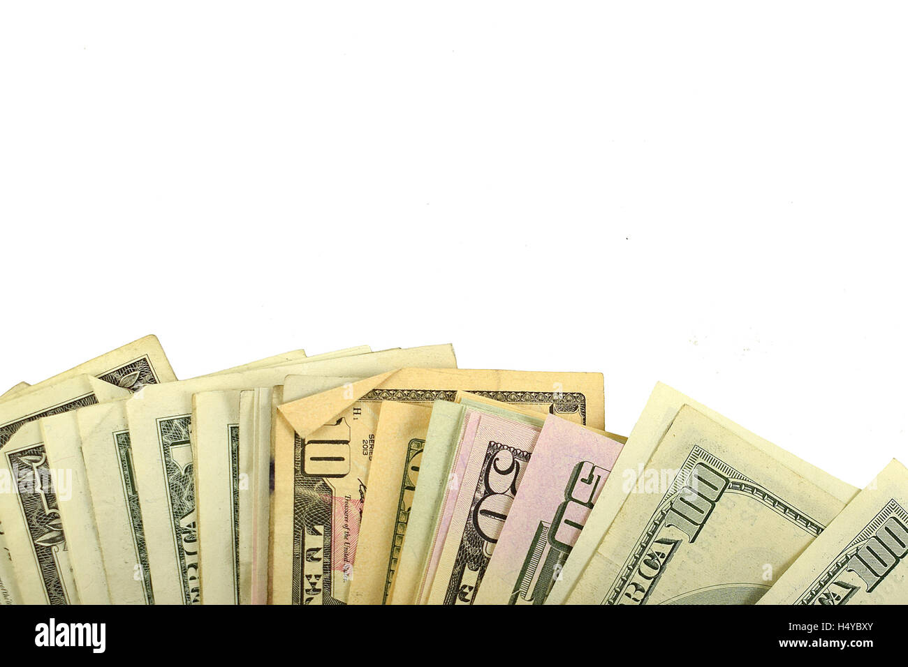 Dollars. Pile of US Dollars on white background. Stock Photo