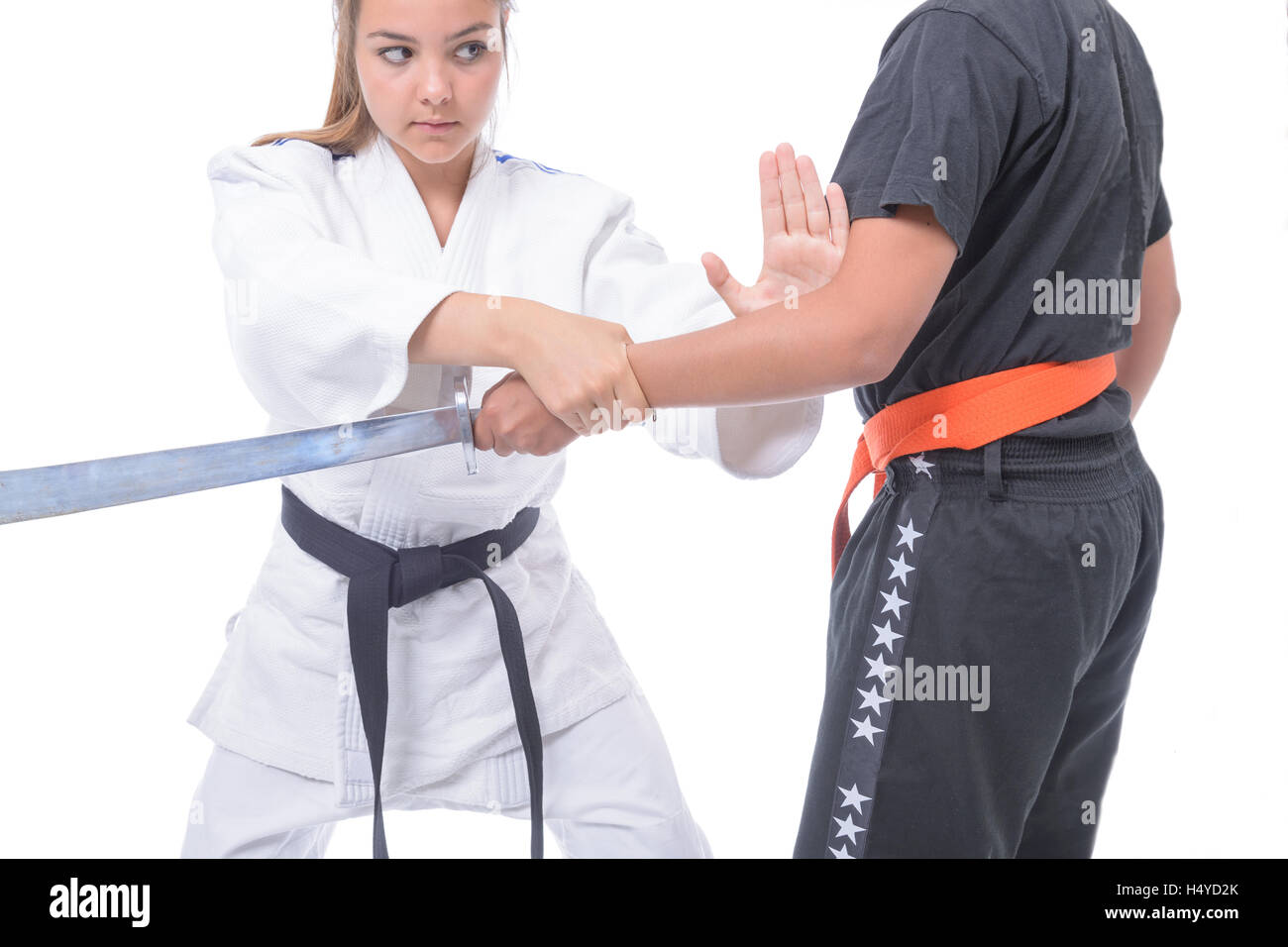 Young athlete exercising with a partner, in selfdefense Stock Photo
