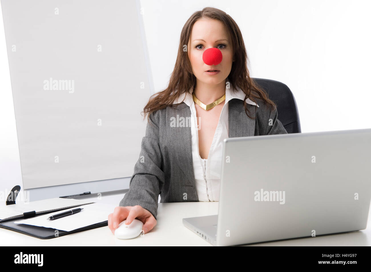 Business woman with a red clown nose Stock Photo