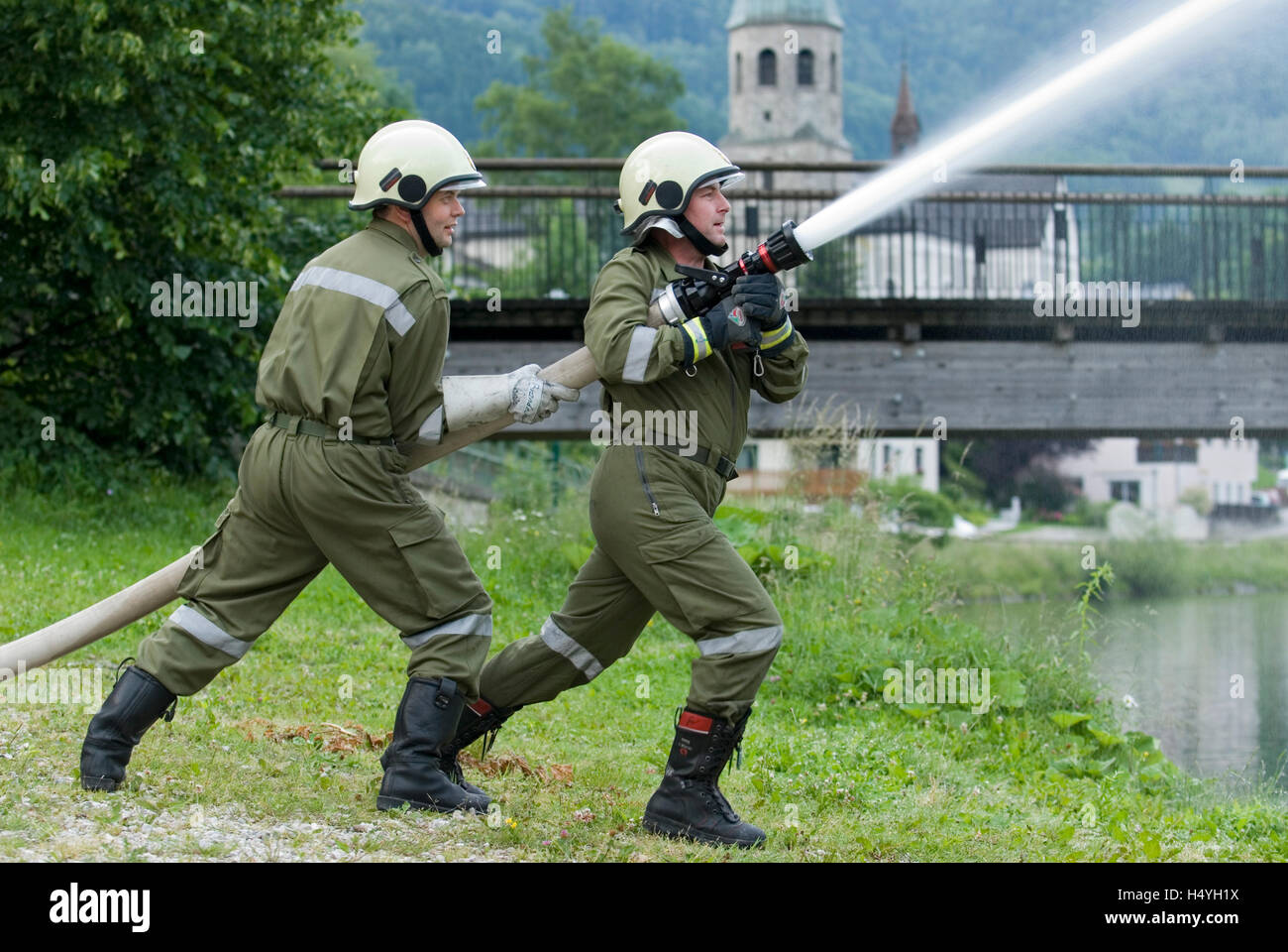 Volunteer Fire Brigade with a water hose, Reichraming, Upper Austria, Austria, Europe Stock Photo