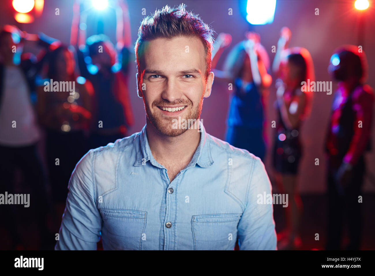 Young man enjoying party in night club Stock Photo