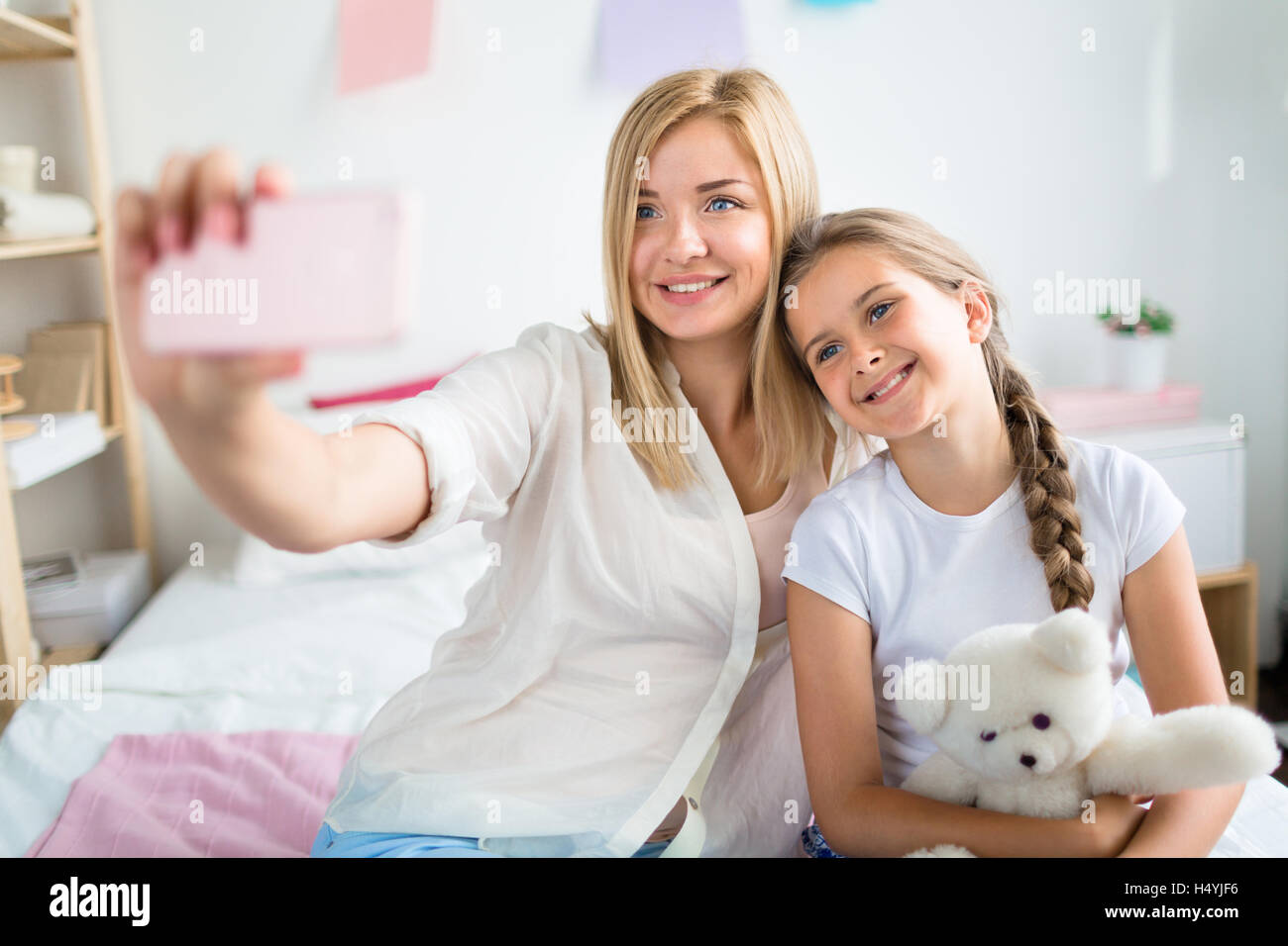 Mother and daughter making selfie at home Stock Photo Alamy