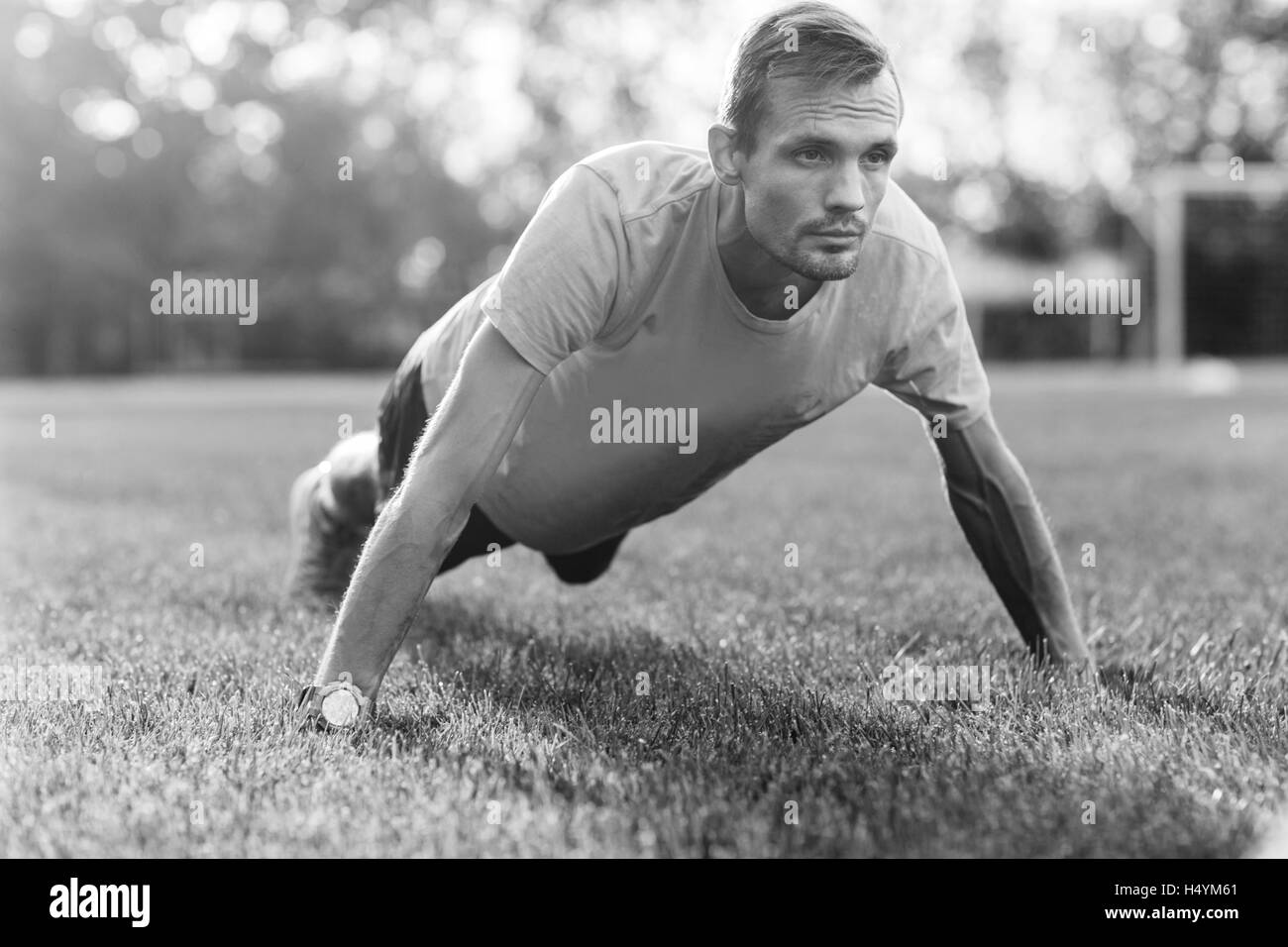 Black and white portrait of man training outdoors Stock Photo