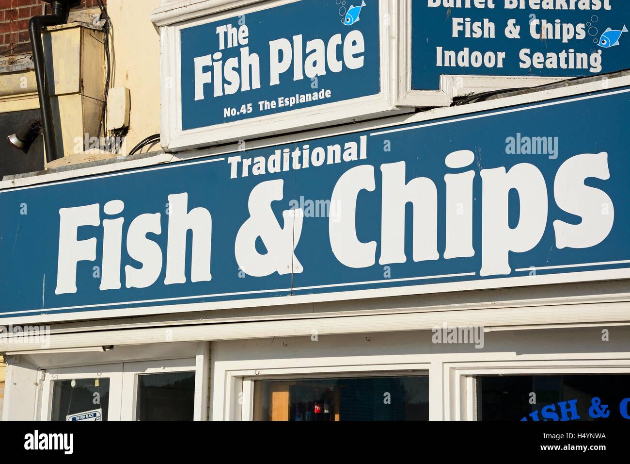 Traditional fish and chips shop sign along the Esplanade, Weymouth, Dorset, England, UK, Western