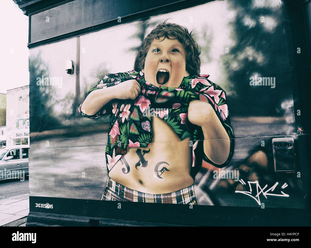 Graffiti art painting of Chunk from the Goonies on a wall in Camden town, London, UK Stock Photo