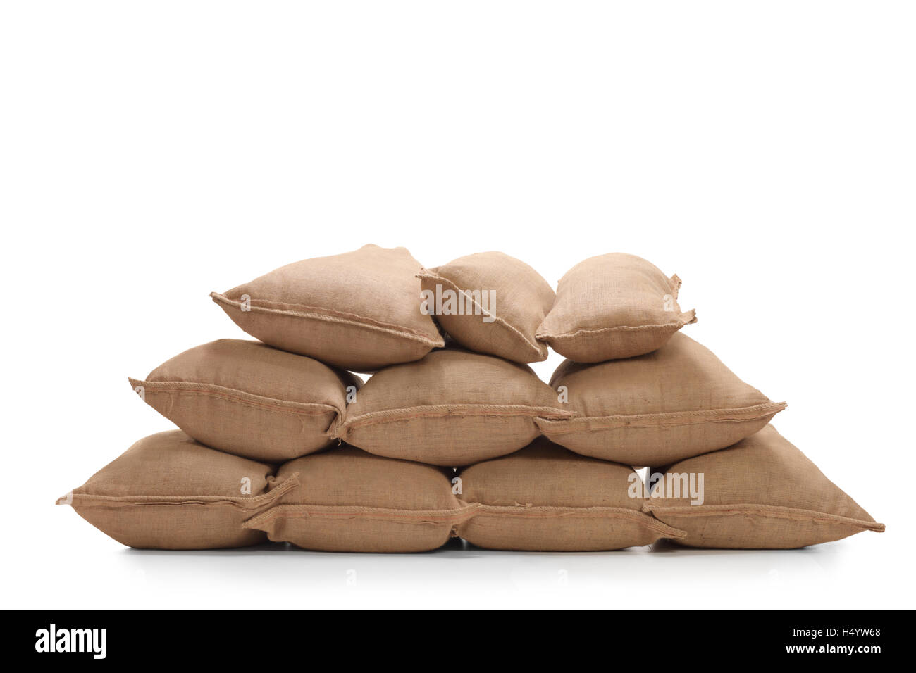 Pile of burlap sacks isolated on white background Stock Photo