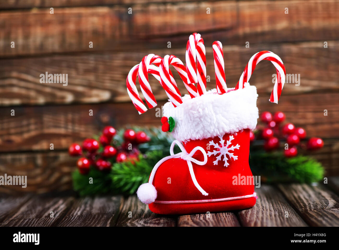 Candy Canes And Christmas Decoration On A Table Stock Photo
