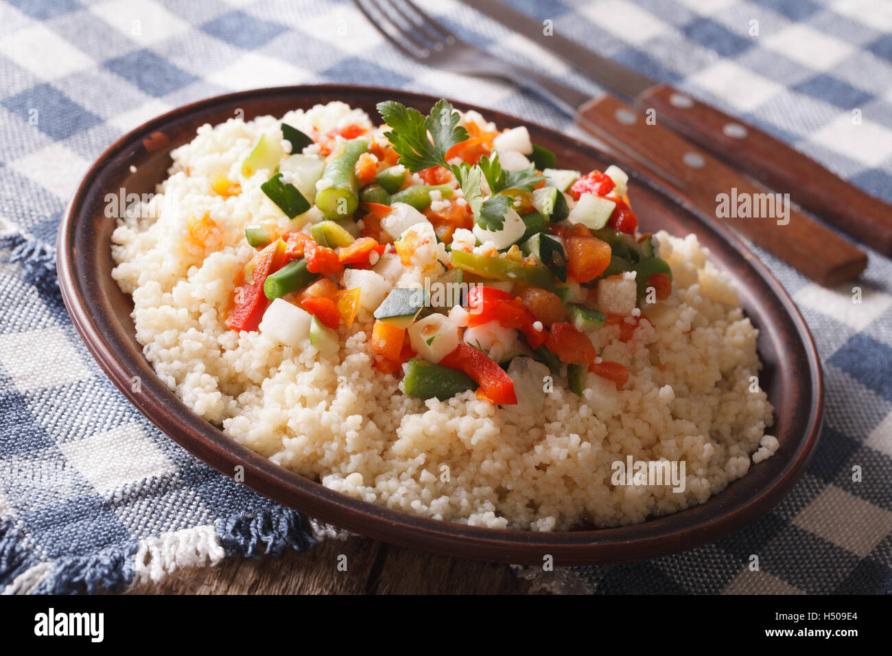 Arabian Food: Cous Cous with vegetables close-up on a plate. horizontal Stock Photo