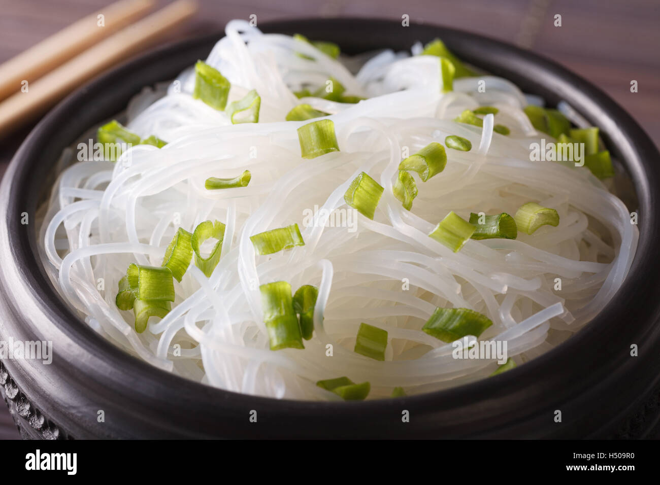 Chinese bean thread noodles in a bowl closeup on the table. horizontal Stock Photo