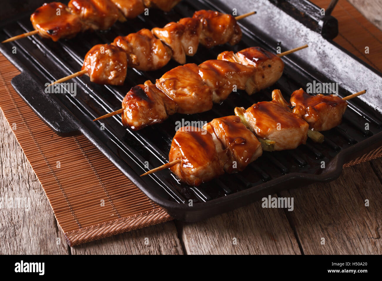 Japanese yakitori barbecue chicken a grill pan. Horizontal close-up Stock Photo - Alamy