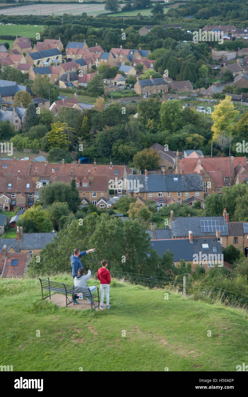 A man and two boys look out over Stoke-sub-Hamdon Somerset Stock Photo