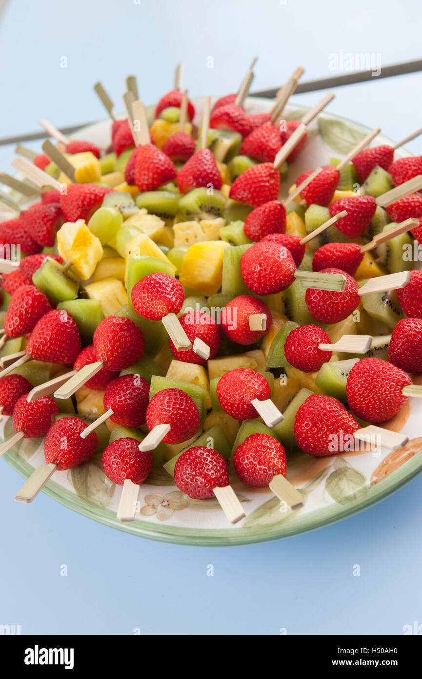 Strawberry, pineapple and kiwi fruit kebabs Stock Photo Alamy
