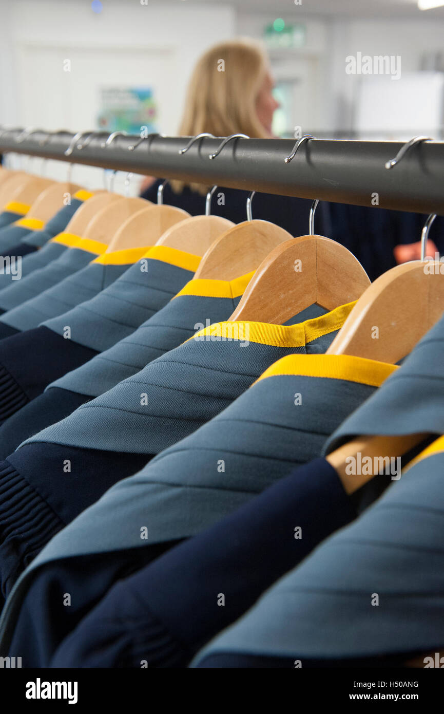 Academic gowns hanging on a clothes rail Stock Photo