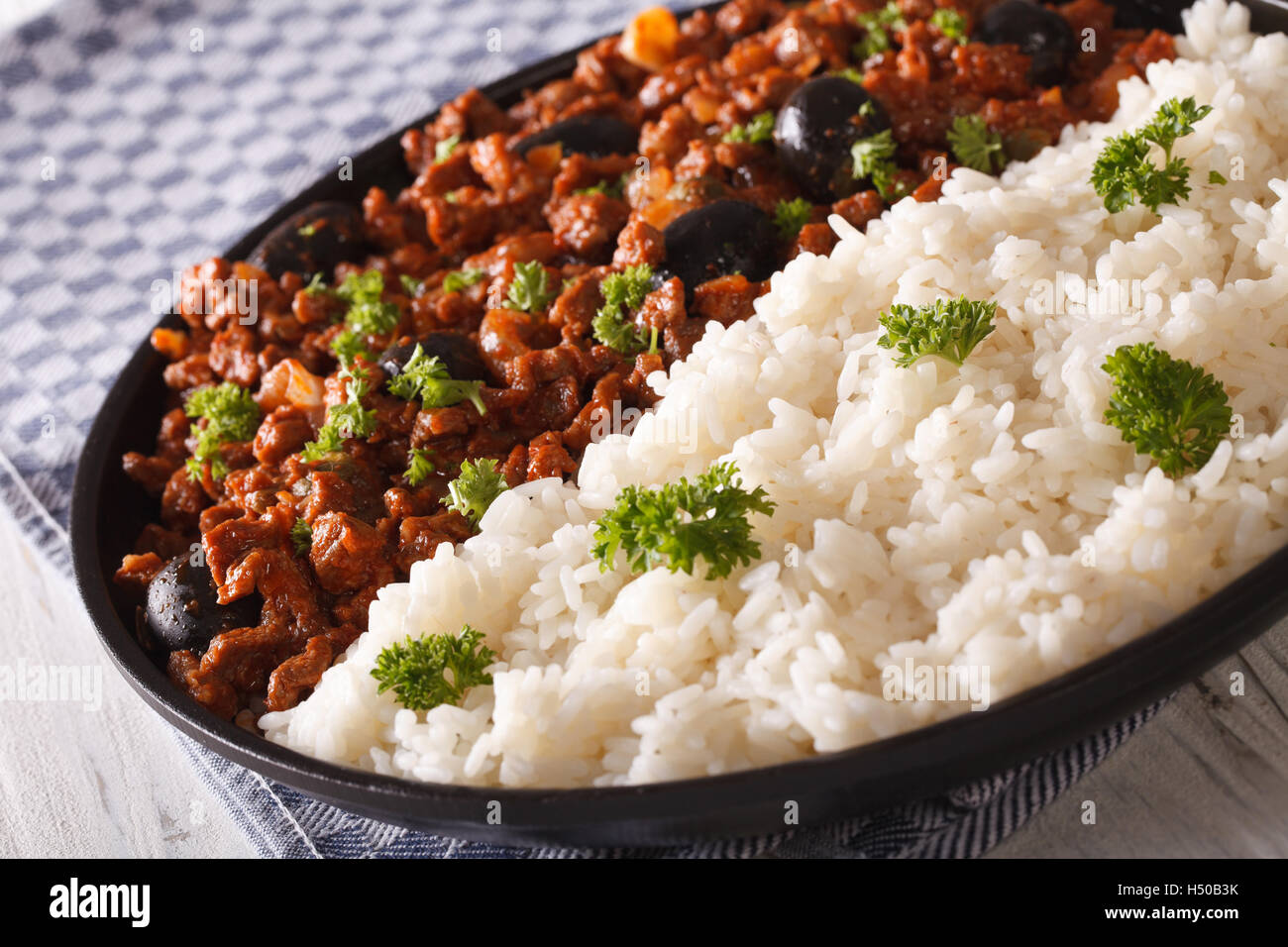 White rice and Picadillo a la habanera close-up on a plate. horizontal Stock Photo