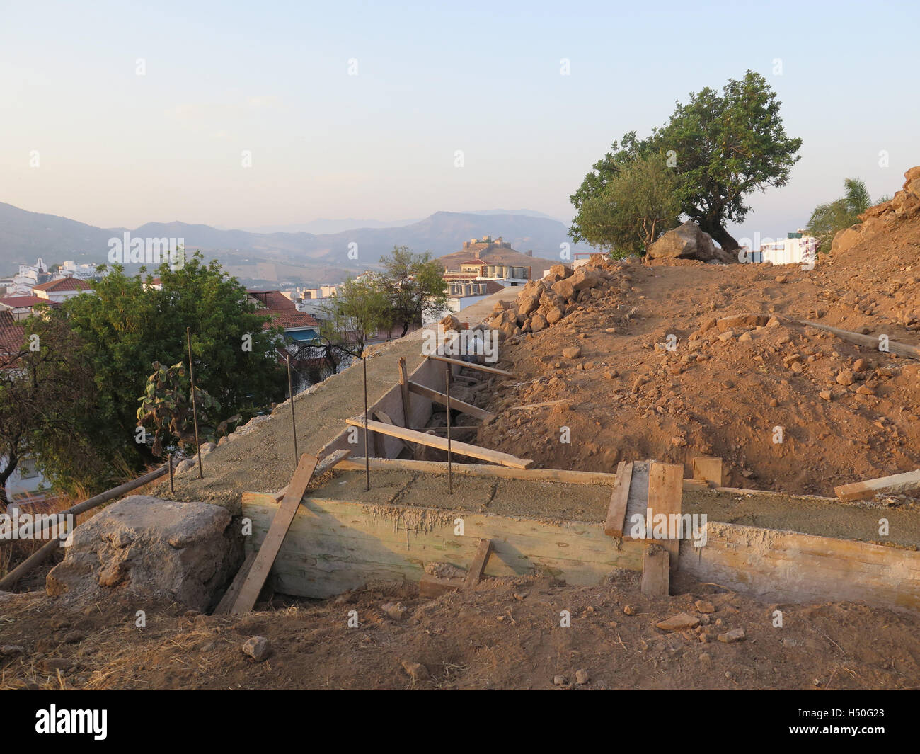 Building a retaining wall for new house on hillside Stock Photo