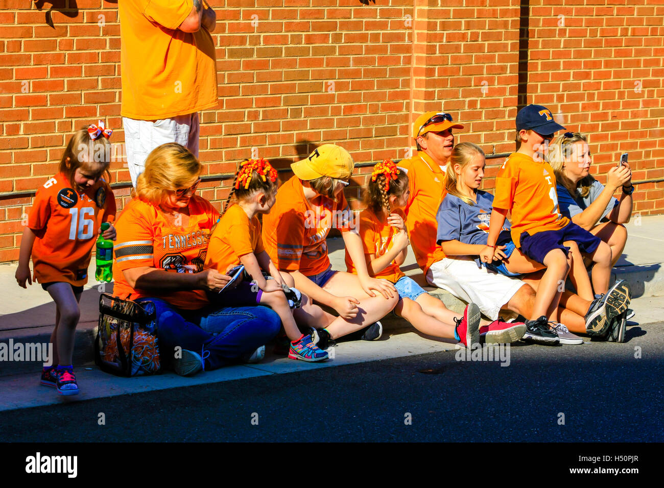 University Tennessee Volunteers supporters in orange apparel outside the Neyland Stadium in