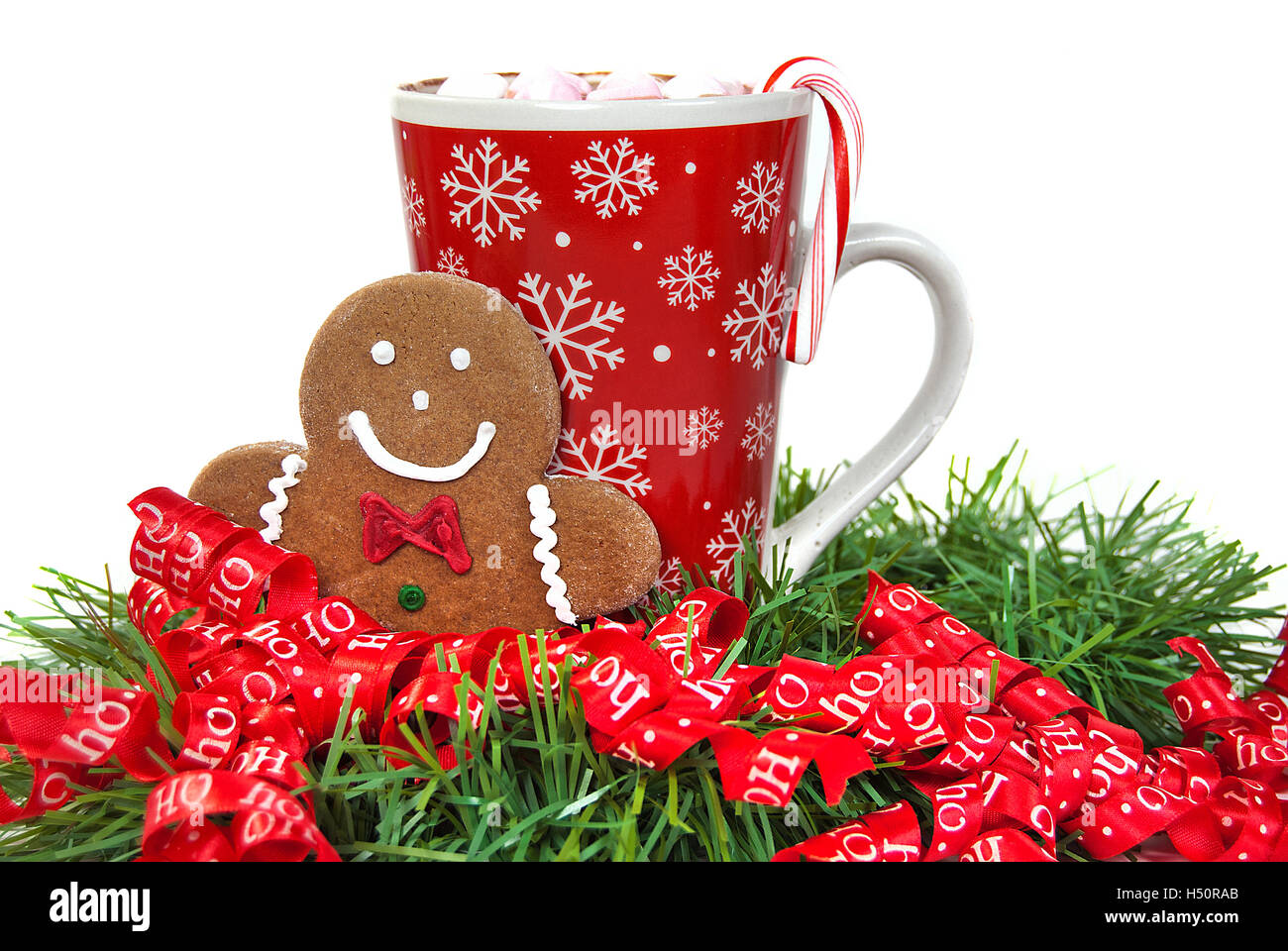 gingerbread man and hot chocolate drink in Christmas ribbon Stock Photo