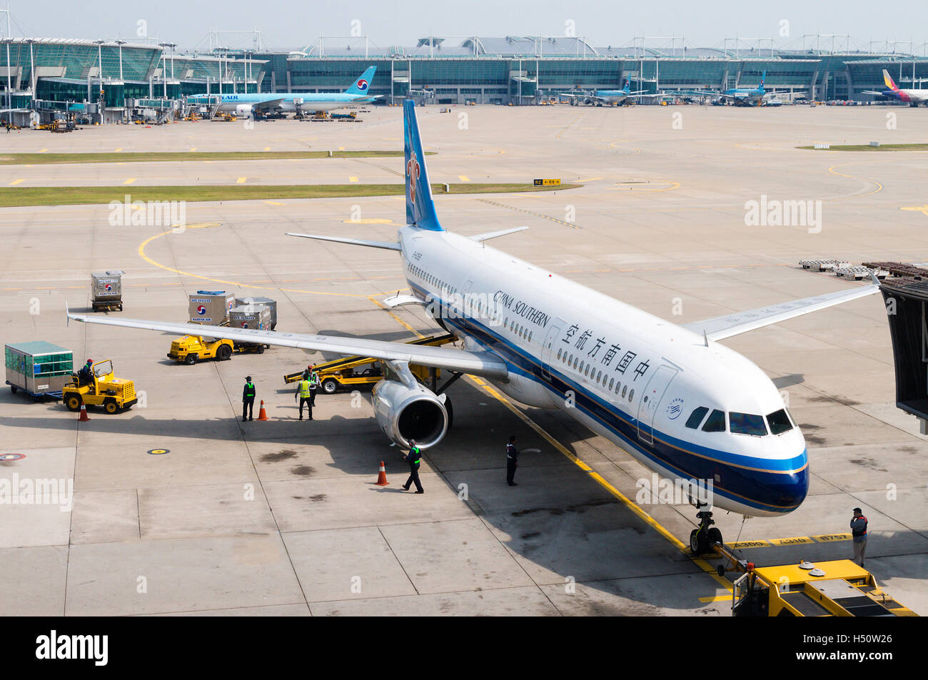 Tokyo, Japan - June 6, 2015: A China Southern Airlines plane being serviced on the tarmac of Tokyo Narita Airport. Stock Photo