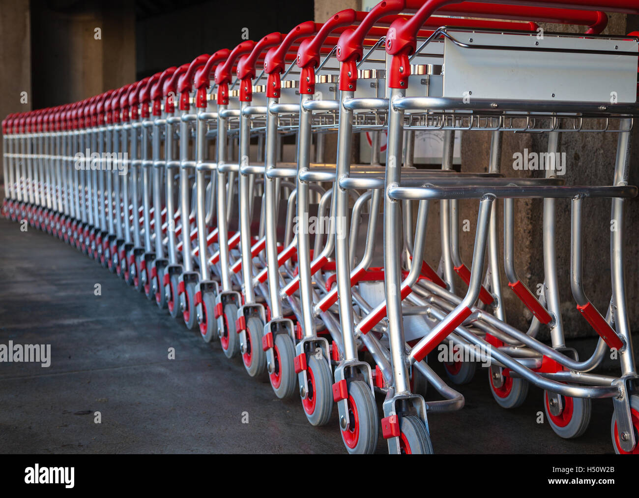 A row of luggage carts at outside the airport Stock Photo Alamy