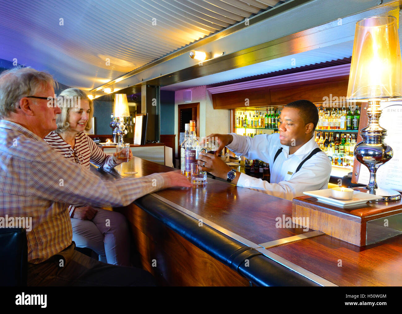 A couple sampling whisky at the famous Bascule Bar a wine & cocktail ...