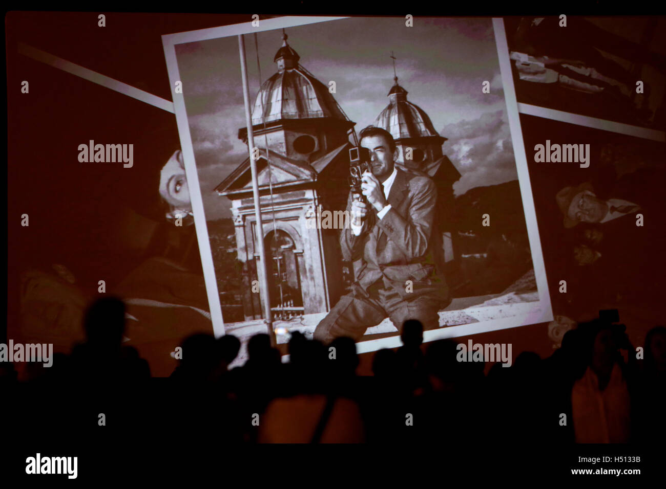 Rome. 18th Oct, 2016. A photo of late U.S. actor Gregory Peck taken in Rome is presented on the screen at Spanish Square on Oct. 18, 2016 in Rome, Italy. The well-known movie Rome Holiday starring Gregory Peck and Audrey Hepburn was screened on Tuesday at Spanish Square of Rome to celebrate the centenary of the birth of Gregory Peck. © Jin Yu/Xinhua/Alamy Live News Stock Photo