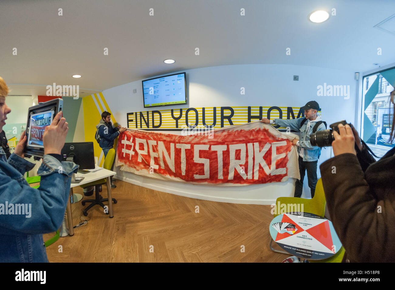London, UK. 19th October 2016. Students with tents and banners in the office of Unite Students, a FTSE 250 company housing around 50,000 students in the UK.  They were protesting over the cost of student housing, once largely an at-cost service by universities, but increasingly big business for private developers at rents often above the entire student loan, higher than all but students from wealthy families can afford. Credit:  Peter Marshall/Alamy Live News Stock Photo