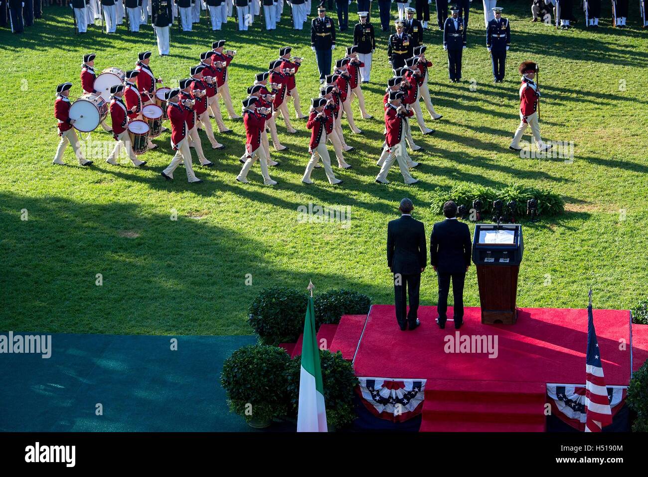 Washington DC, USA. 18th Oct, 2016. U.S. President Barack Obama and Italian Prime Minister Matteo Renzi watch the U.S. Army Old Guard Fife and Drum Corps parade during the State Arrival ceremony on the South Lawn of the White House October 18, 2016 in Washington, DC. Credit:  Planetpix/Alamy Live News Stock Photo