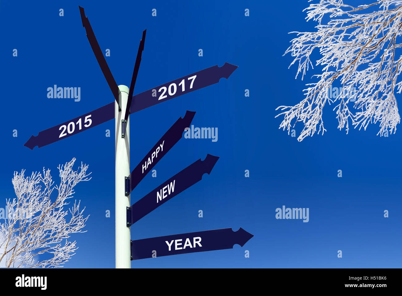 Happy new year 2017 on direction panels, snowy trees Stock Photo
