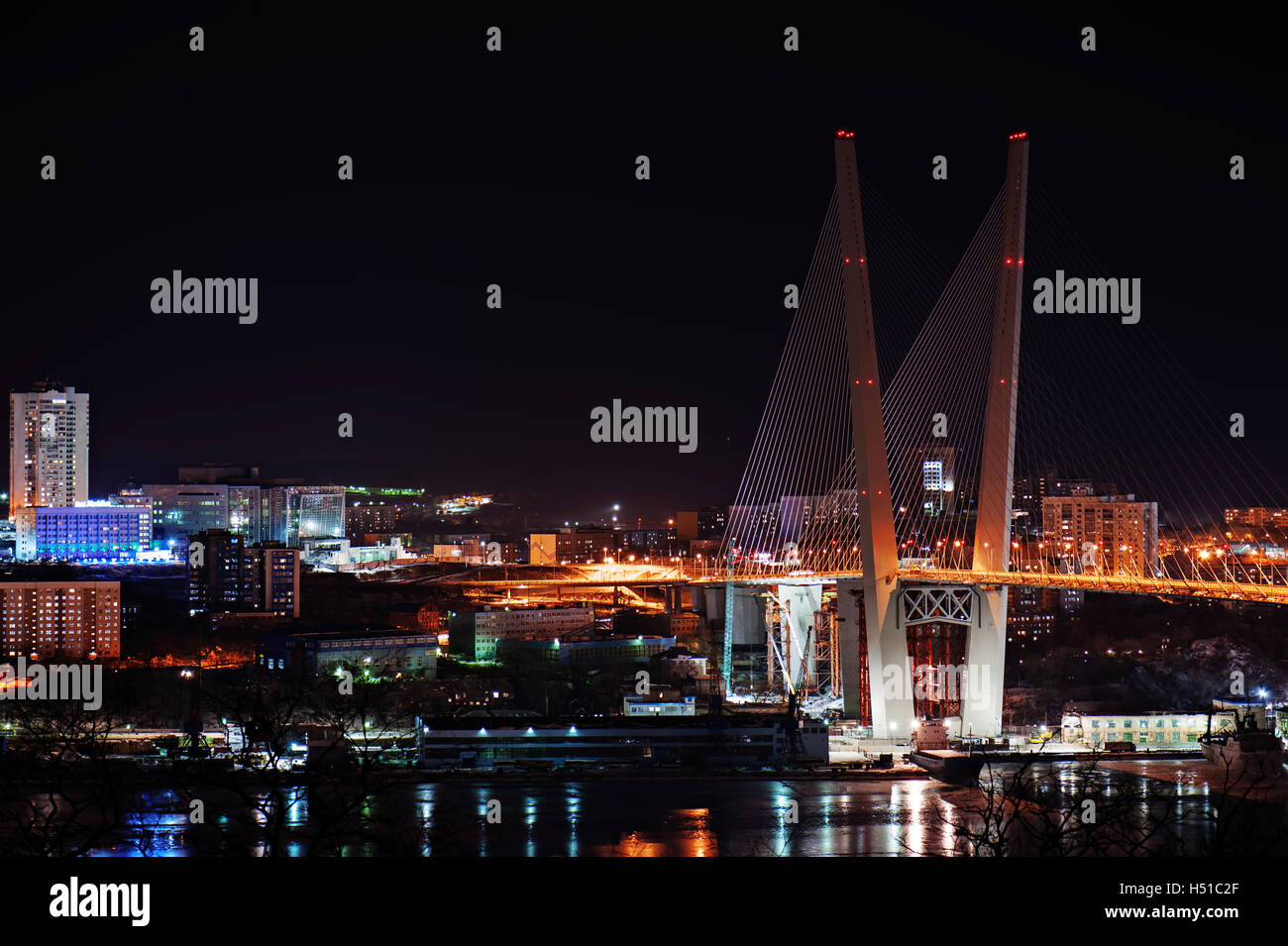 night view of the bridge in the Russian Vladivostok over the Golden Horn bay Stock Photo