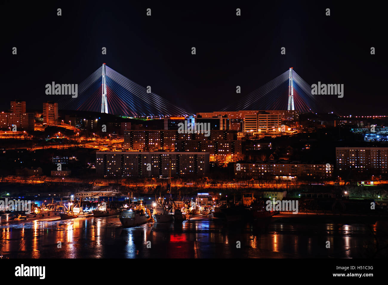 night view of the longest cable-stayed bridge in the world in the Russian Vladivostok over the Eastern Bosphorus strait to the R Stock Photo