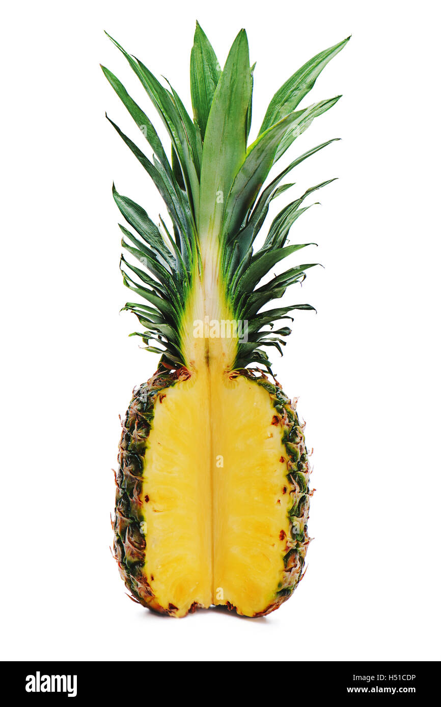 Ripe whole pineapple with a quarter cut isolated on white background. Stock Photo