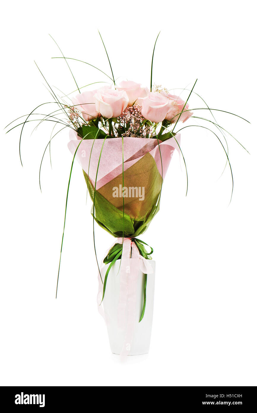 Colorful flower bouquet from pink roses in white vase isolated on white background. Stock Photo