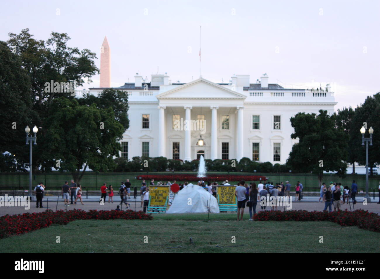 The Whitehouse in Washington DC with protest signs make peace not war Stock Photo