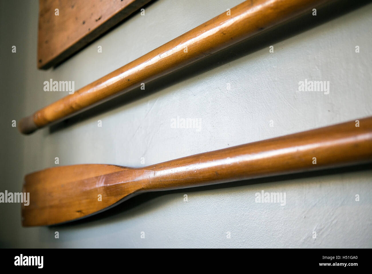 oars on wall,oar, old, wood, grain, isolated on white, rowing, crack, stain, clipping path, used, blade, paddle, weathered,tidal Stock Photo