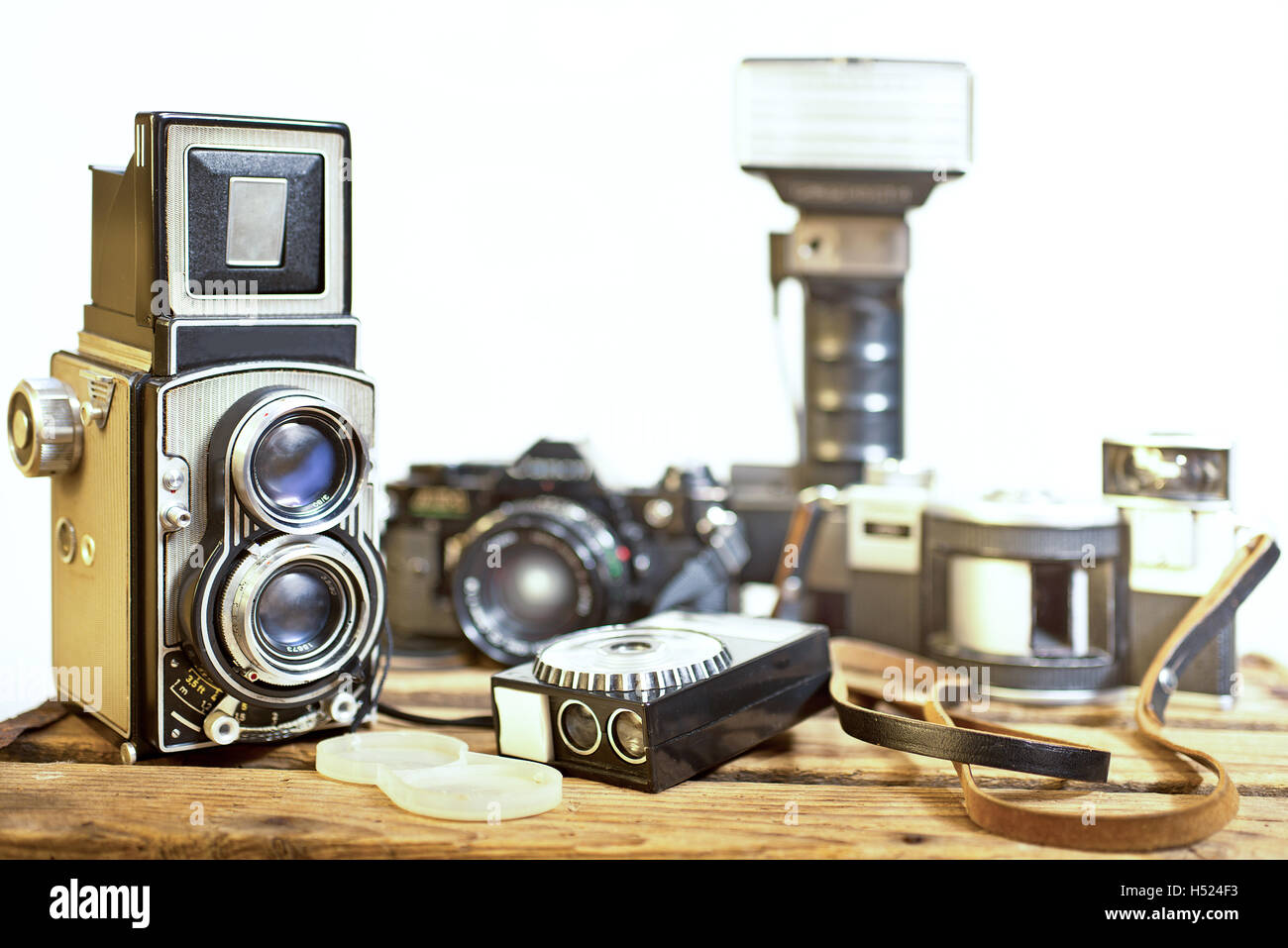 old analogue photographic cameras on the white background Stock Photo