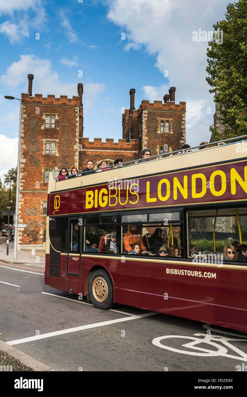 A tourist bus passes in front of Lambeth Palace, the official London Residence of The Archbishop of Canterbury, London, UK Stock Photo