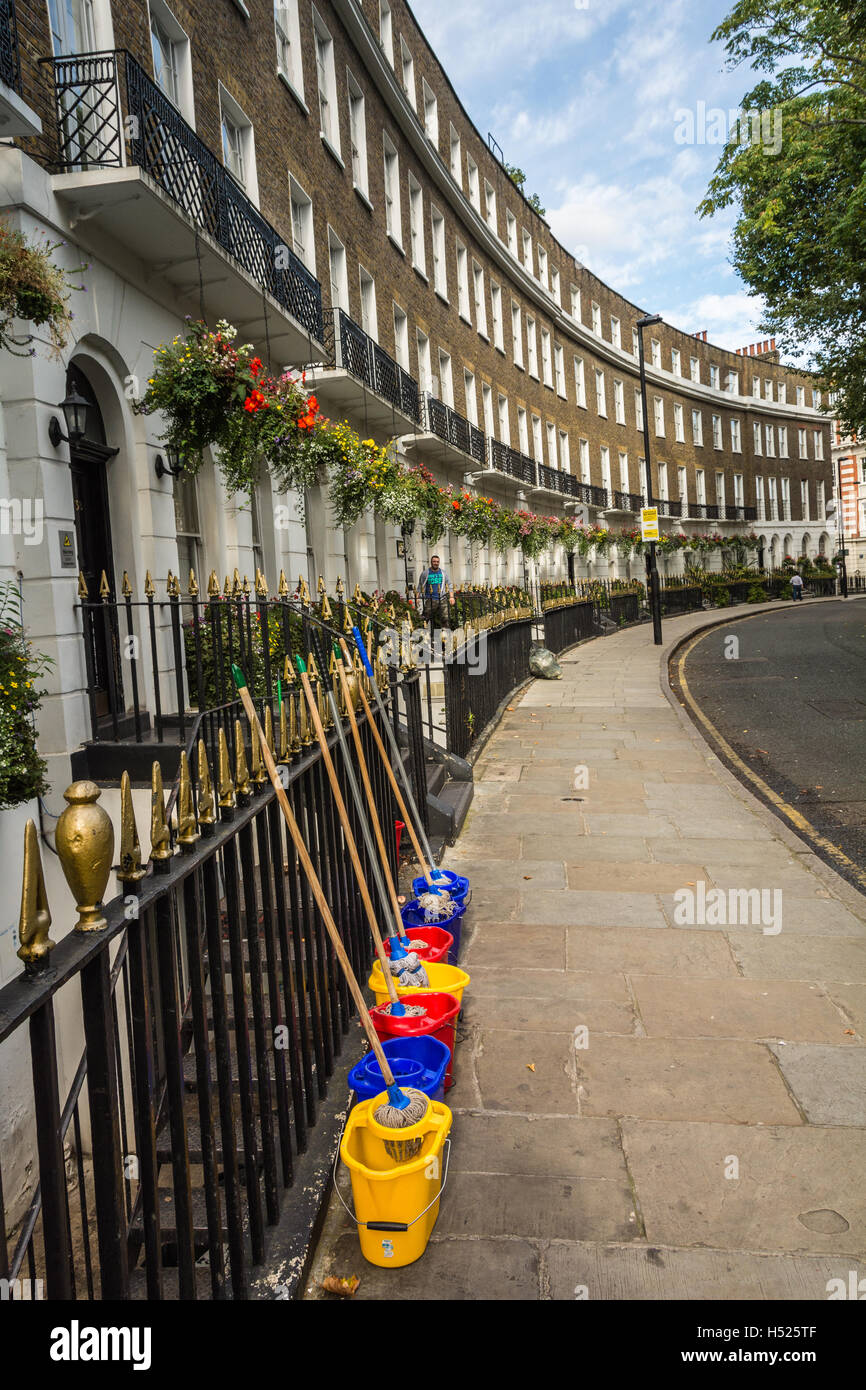 Mops and buckets outside hotels in one of London's most beautiful