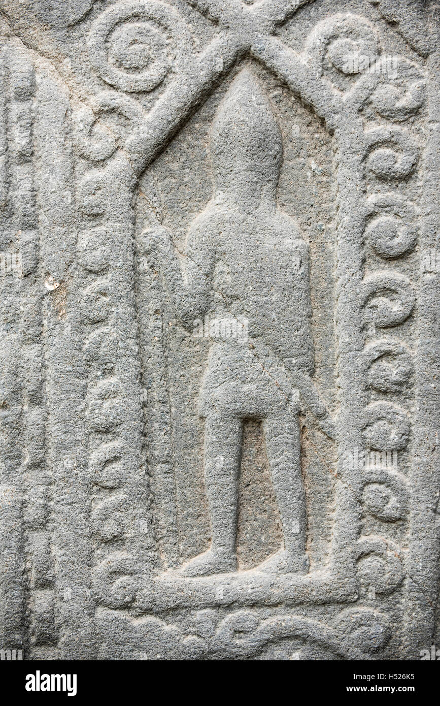 Carved medieval warrior, detail of the Kilmartin Stones, collection of 79 ancient graveslabs, Argyll, Scotland Stock Photo